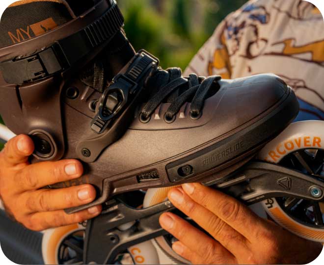 Close up image of a black carbon fiber HC Evo Trinity inline skate boot