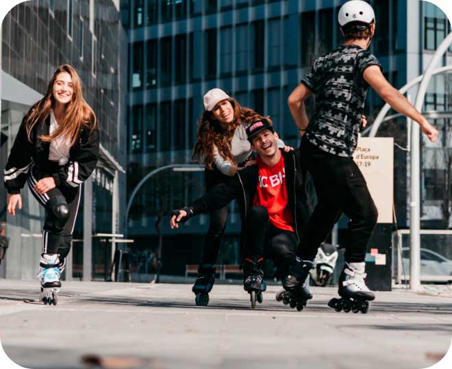 Four people smiling and having fun on Powerslide inline skates