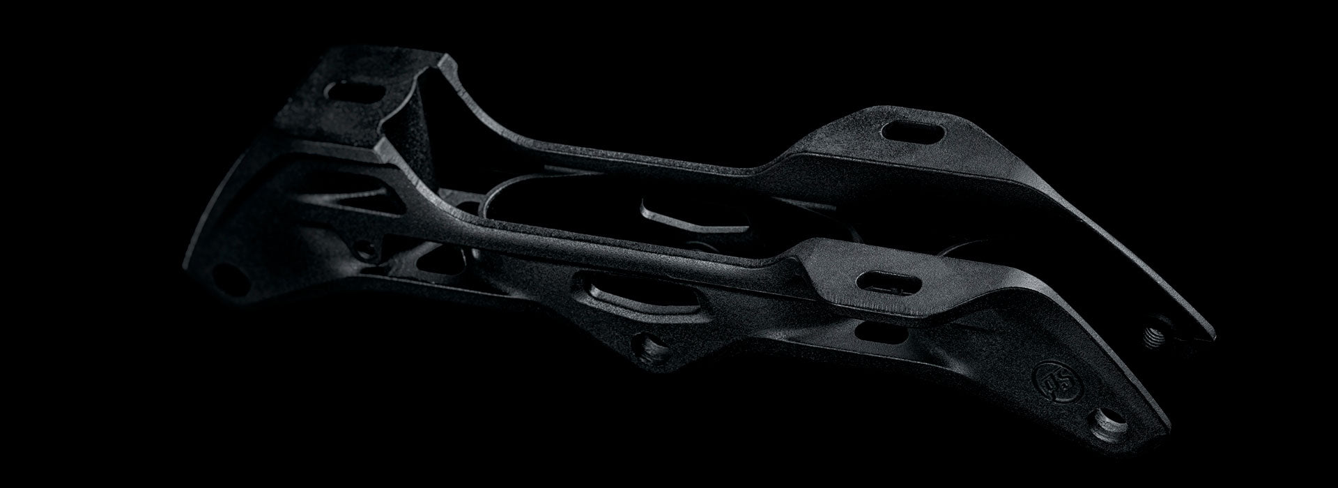 A close-up image of a Powerslide Elite inline skate frame without wheels