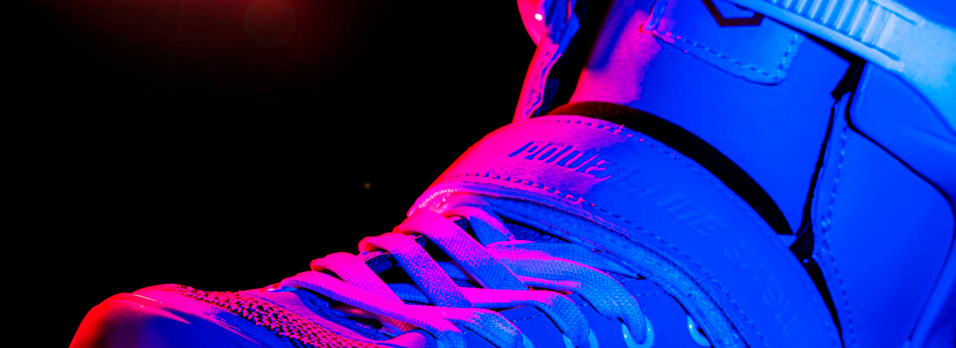 A close-up image of the upper portion of the Powerslide Swell inline skate with artistic pink lighting